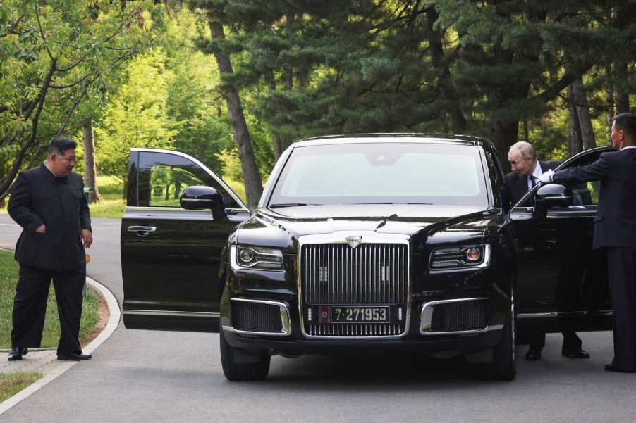 Kim Jong Un and Vladimir Putin outside Aurus Senat limousine.