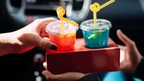 Two girls with cocktails in the car