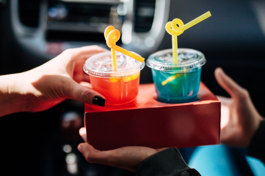 Two girls with cocktails in the car