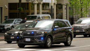 A police car on the road in the city