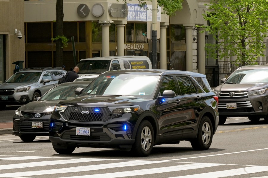 A police car on the road in the city