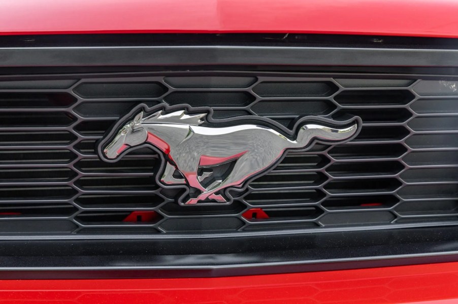 The front grille emblem on a 2012 Ford Mustang GT in very close view