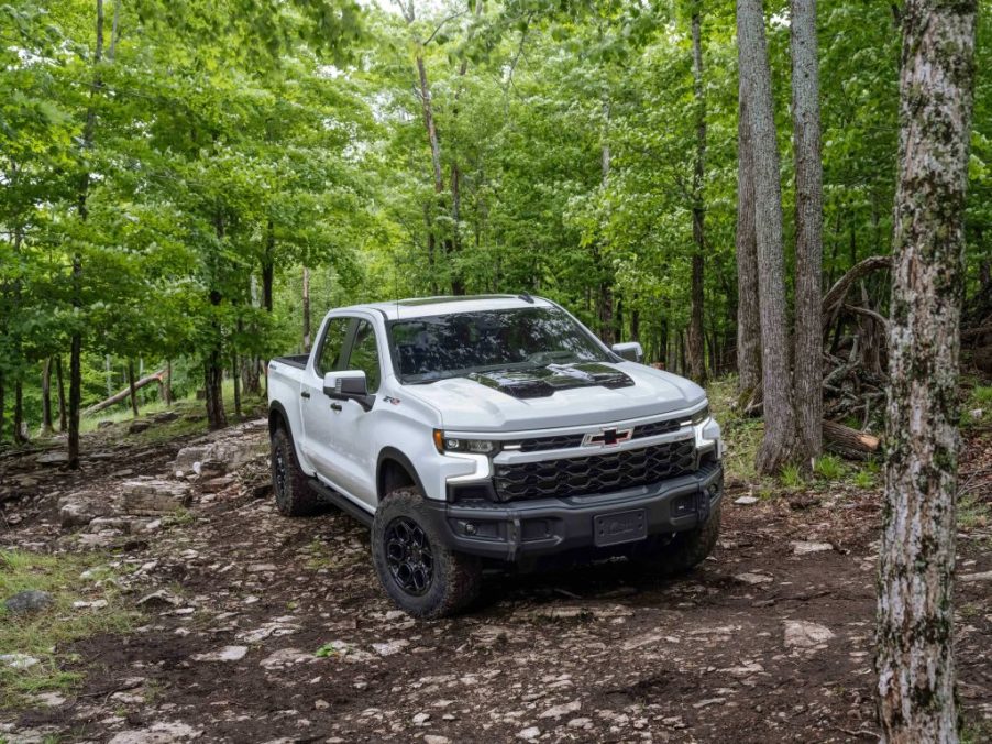 The 2024 Chevrolet Silverado 1500 off-roading in the woods