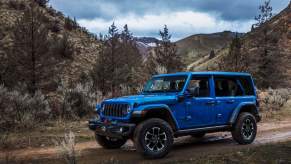 The 2024 Jeep Wrangler 4xe on a muddy path