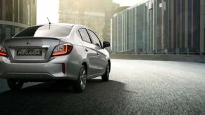 A silver 2024 Mitsubishi Mirage G4 sedan, slated for discontinuation, shows off its rear-end styling.