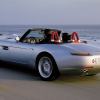 A BMW Z4 convertible, like the one Matthew Perry owned, drives up the coast.