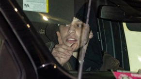 Pete Davidson driving a car at night