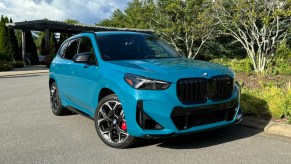 The 2024 BMW X1 M Sport parked near foliage