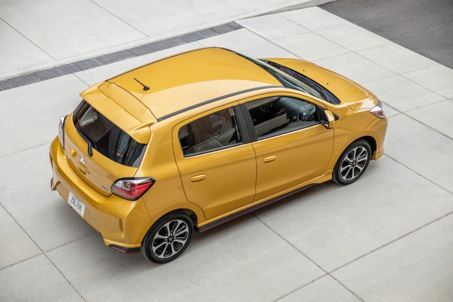 A yellow Mitsubishi Mirage, a natural competitor for the Nissan Versa, shows off its hatchback styling.