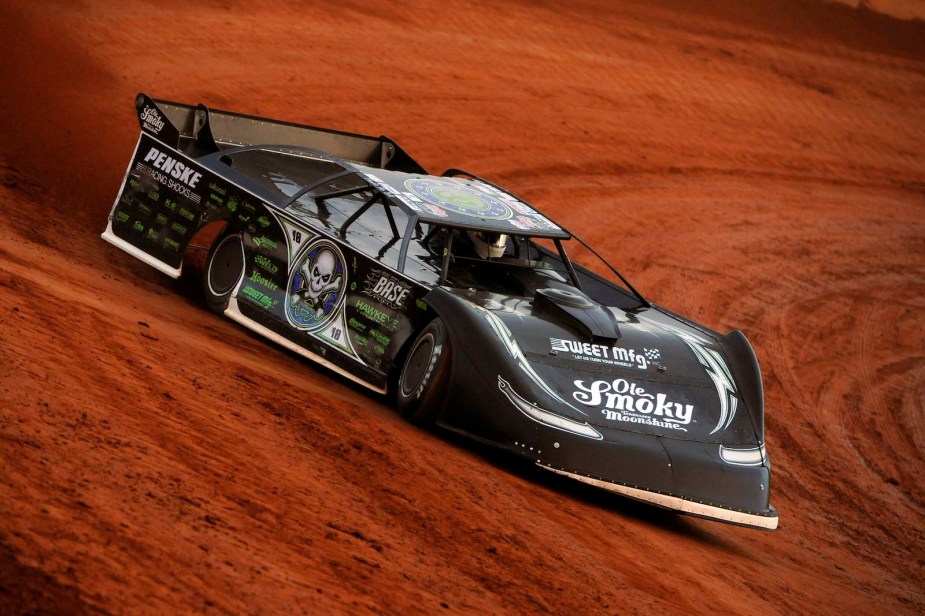 Scott Bloomquists Ford Mustang on a dirt track, practicing for a Lucas Oil Series race.