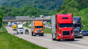 A series of truckers driving semi-trucks on an American highway.