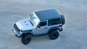 Overhead view of a silver Jeep Wrangler SUV.