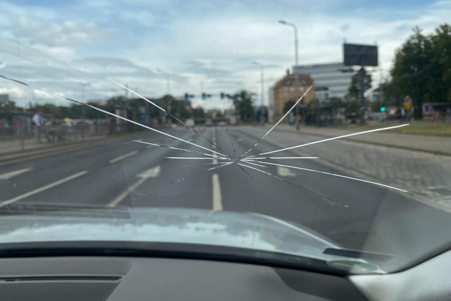 A car windshield requires repair after a crack spreads.