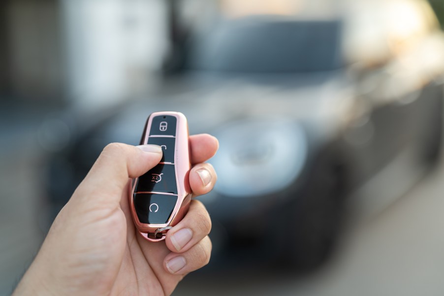 A person using a car key fob