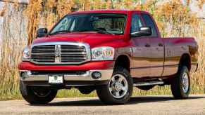 A red 2008 Dodge Ram pickup truck parked in left front angle view