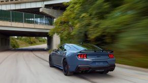 An S650 Ford Mustang GT driving on city streets.