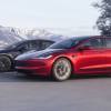 A pair of Tesla model EVs, the brand's cheapest electric cars, on the road.