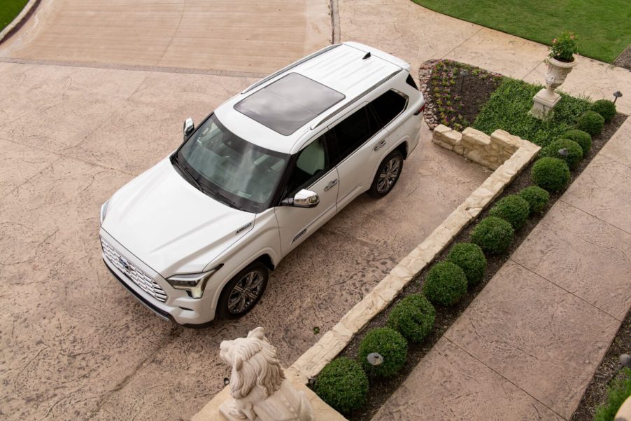 A white 2024 Toyota Sequoia, one of the fastest-selling cars in the U.S. in Q3 2024, in left low aerial view