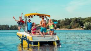 A party crowd enjoys drinks on a boat, but the driver could end up with a DUI on a boat, or a BUI.