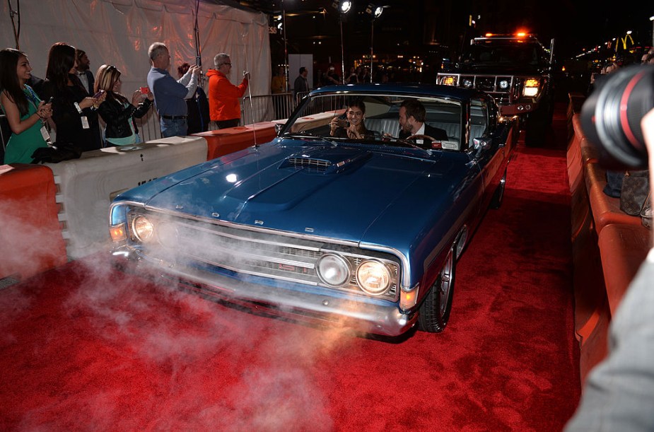 Aaron Paul in his 1969 Ford Torino on the read carpet