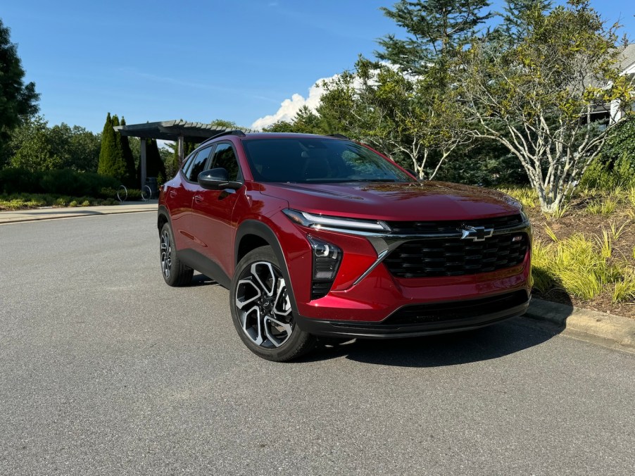 The 2024 Chevy Trax near trees and bushes