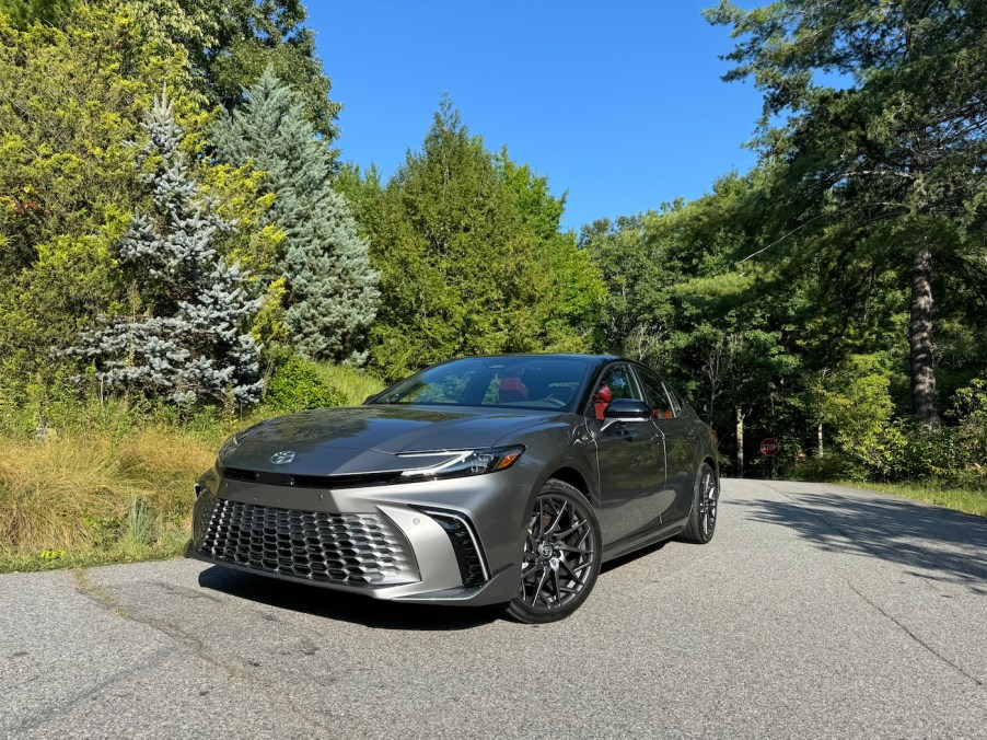 The 2024 Toyota Camry Hybrid in a park