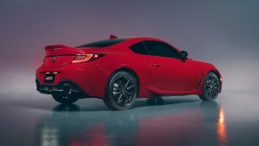 A red Toyota GR86 shows off its rear-end styling.