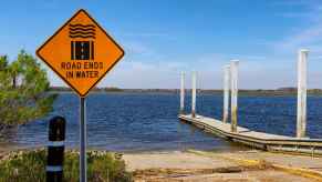 A boat ramp in Charleston, South Carolina, with a sign that reads "Road ends in water."