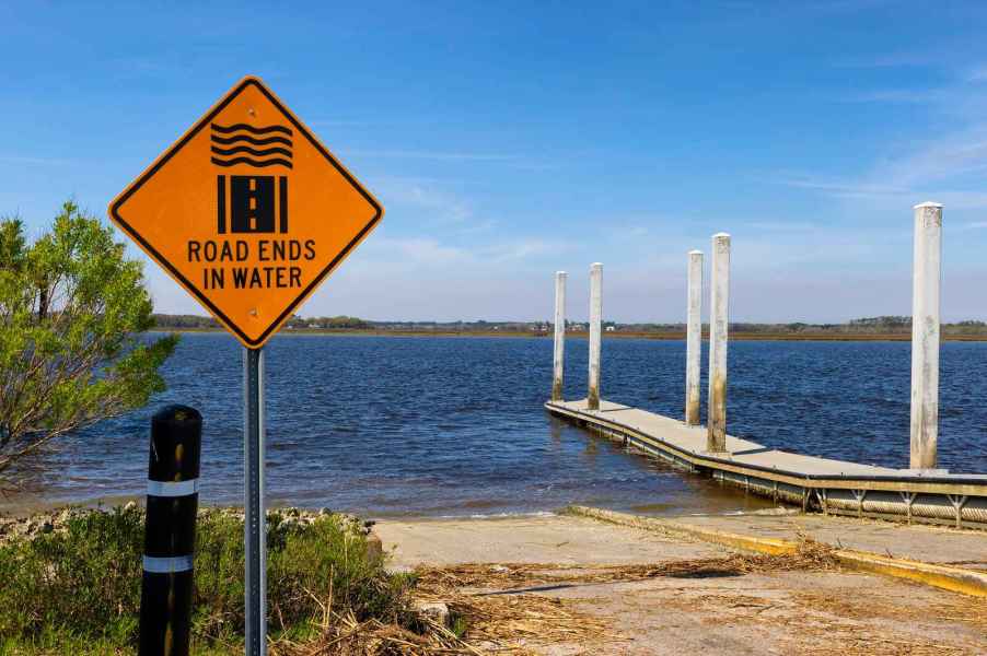 A boat ramp in Charleston, South Carolina, with a sign that reads "Road ends in water."