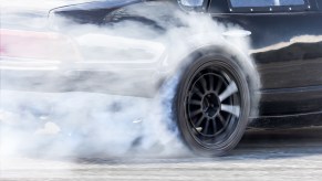 A smoking tire on a race track