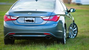 A 2011 Hyundai Sonata parked in grass