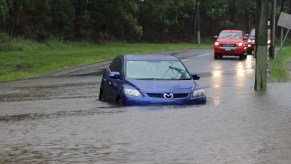 A car standard in flood water