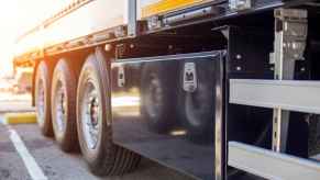 Semi-truck trailer toolbox mounted on left side in close view