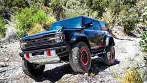 The 2024 Ford Bronco crawling over rocks