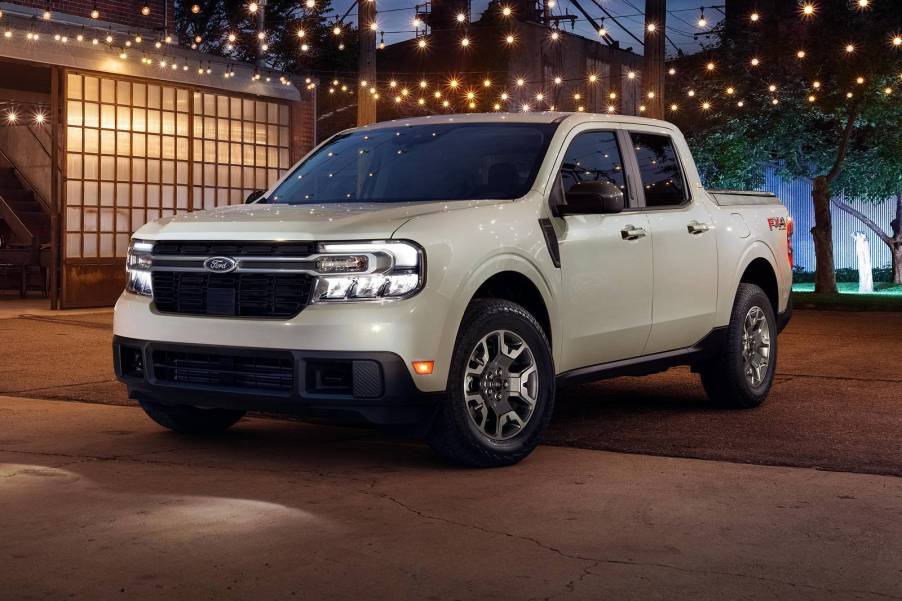 The 2024 Ford Maverick Hybrid parked by a home