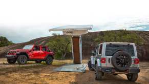 Two 2024 Jeep Wrangler 4xe models charging