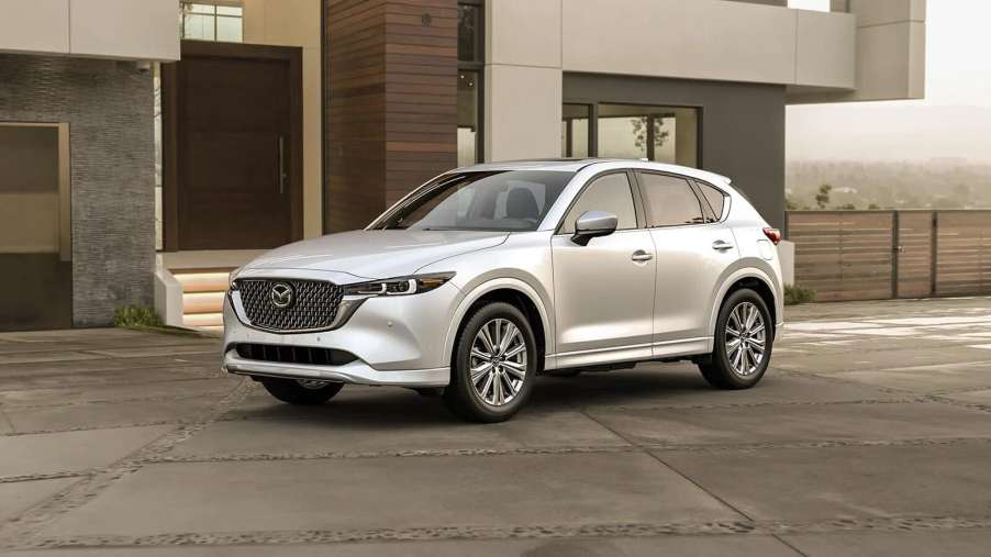 The 2024 Mazda CX-5 parked by a home