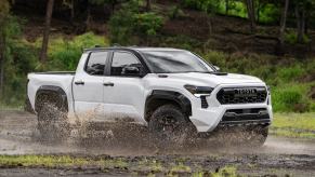 The 2024 Toyota Tacoma splashing through mud