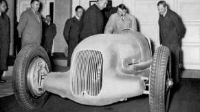 Adolf Hitler with a Silver Arrow Mercedes-Benz racing car in 1936.