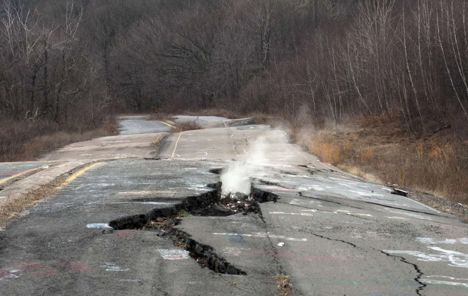 Smoke rising through a crack in the pavement in the ghost town of Centralia, PA