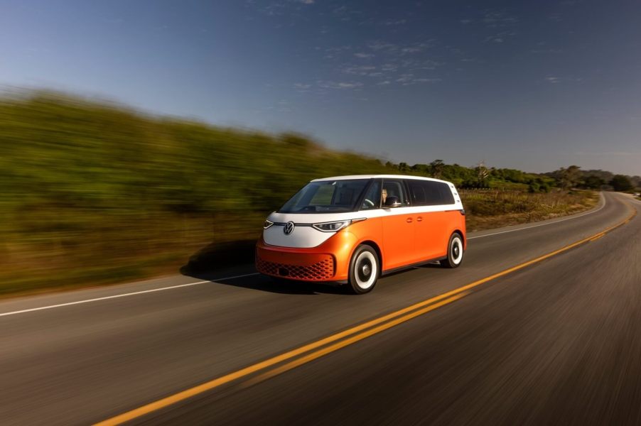 A two-tone 2025 Volkswagen ID. Buzz drives on an open California road.