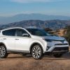 A white 2016 Toyota RAV4 SUV parked in right front angle view