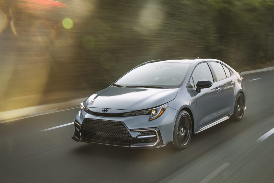 A grey 2021 Toyota Corolla driving in left front angle view