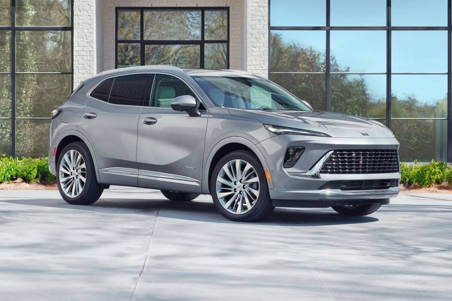 The 2024 Buick Envision parked near a building