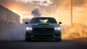 A 2024 Ford Mustang GT in thick smoke.