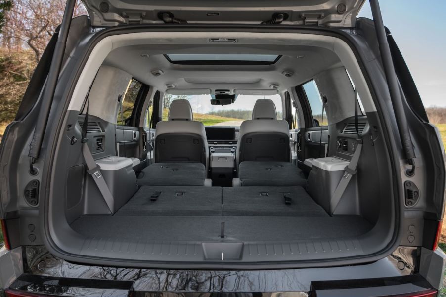 Interior of a three-row Hyundai Santa Fe SUV with the 3rd row folded flat.