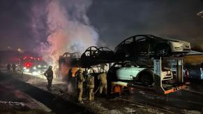 Involved electric car fires consumed several Teslas on a transporter in Turkey, despite the efforts of firefighters.