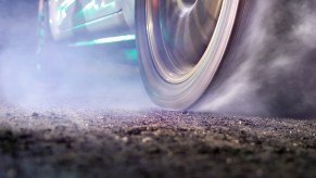 Closeup of a tire burning out during a drag race.