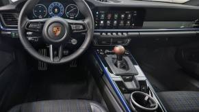 One of the cheapest Porsche 911 specs, the 2025 Porsche 911 Carrera T, shows off its manual transmission shifter.