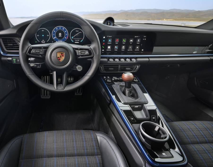 One of the cheapest Porsche 911 specs, the 2025 Porsche 911 Carrera T, shows off its manual transmission shifter.